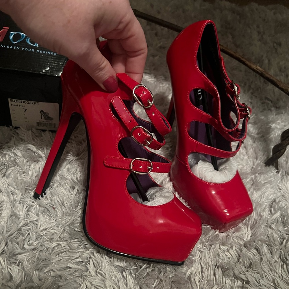 Red strappy heels. Devious by Pleaser
